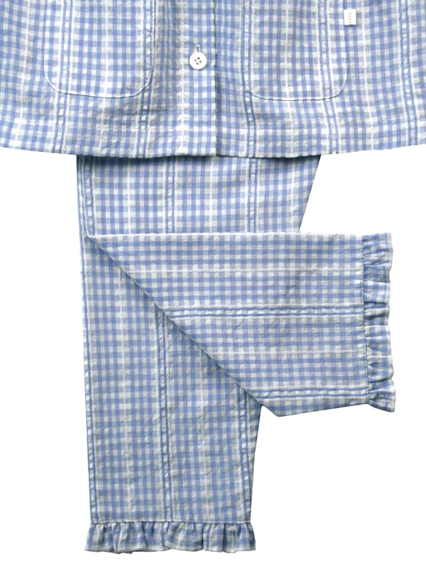 Pretty in blue... We think you're going to love our new seersucker mini check in the most beautiful pastel blue and white. There's so much woven detail in this fabric design.
Spring & Summer weight 100% Cotton with short puffed sleeves
Understated and timeless styling, our classic styling has a peter pan collar, engraved pearl effect buttons, front pockets and feminine gathers. With the trousers having an elastic waist, it makes them easy to get on and off. Our beautiful girls PJ set will keep your little one cool on the hot summer nights!
100% Cotton
Elastic waist
Front pockets
Button through top
Machine washable
Peter Pan collar
