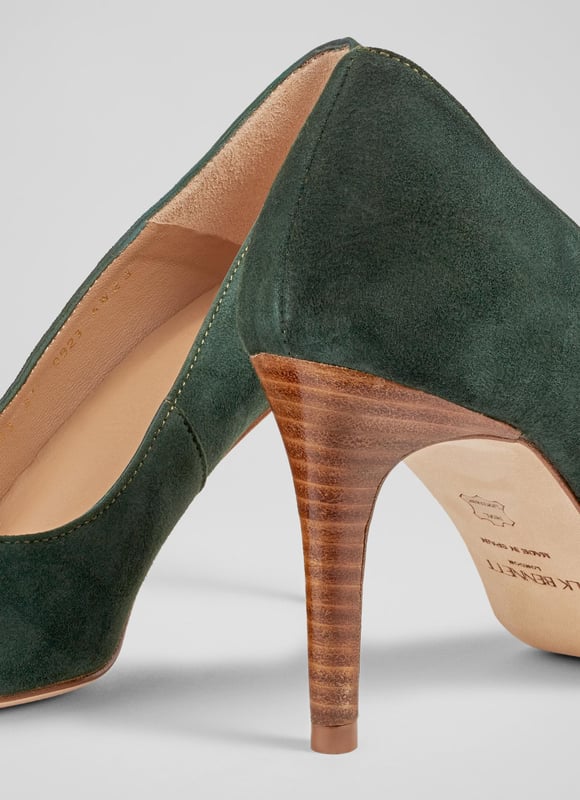 LK Bennett Floret Closed Courts,Dark Green An undeniable 'classic', our Floret courts are a much-loved LKB signature style, with a loyal fan base who appreciate their sleek and stylish everyday appeal. Beautifully-crafted in Spain from super-soft forest green suede, they have a pointed toe, a single sole and a wooden stacked 85mm stiletto heel. They're the perfect courts for dressy moments or for smartening up your workwear.