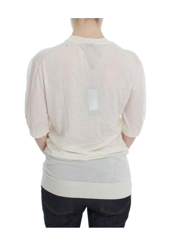 Brand: Dolce \\u0026 Gabbana.\\n  Condition: Brand new with tags.\\n  Material: 100% cashmere.\\n  Color: White.\\n  Sleeve: 1/2 sleeve.\\n  Made in Italy.\\n  Logo details.