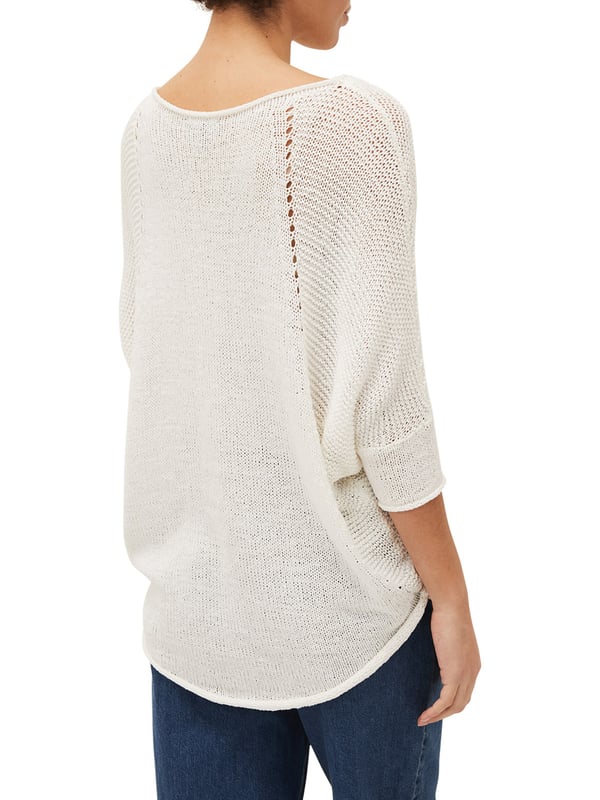 This style is responsibly sourced. We're proud to invest in making cotton production more sustainable. A textured tape yarn jumper complete with batwing sleeves and contrast stitch detailing. Finished with a curved extended hem at the back for a flattering fit. This semi-sheer style is best worn with a camisole underneath.