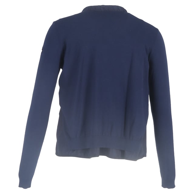 VINTAGE, RRP AS NEW
Add a touch of feminine sophistication to your wardrobe with the Moncler Ruffled Collar Zipped Cardigan in navy blue wool. This luxurious cardigan combines modern design with classic comfort, crafted from soft, breathable wool that provides warmth and a cozy feel, while the rich navy blue hue offers timeless versatility.

 Moncler Ruffled Collar Zipped Cardigan in Navy Blue Wool

Condition: Excellent
Signs of wear: No retail tag but Brand tag on., No visible sign of wear., 
Packaging: None
Color: Blue | navy blue
Material: Wool
Size: INT | L/UK14/IT46/US10/FR42
Measurements: Length: 550
SKU: NAPPUGBCL444354W