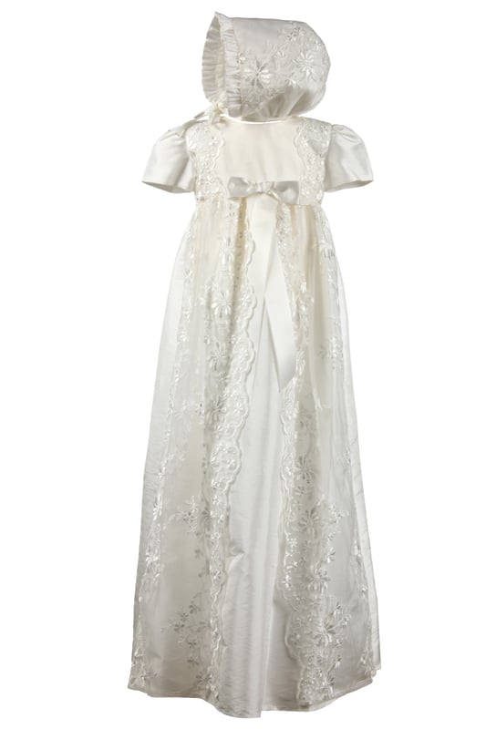 Fairly new to our traditional gown collection is style HARMONY Christening robe.  Suitable for baby girls or boys, this would make a beautiful heirloom. 
 
This long christening robe is made from our popular Mock Silk, easy for spot cleaning when your little one has that inevitable milk burp. We've all been there...
It has short sleeves and beautiful lace details on the body running down the full length of the skirt. 
We've added some lace detailing to the back as well. Don't forget when you hold your baby towards you, the back of the dress will be seen by everyone. It's always good to have some interesting details on the back. The opening is a concealed zip fastening.
We've complimented this gown with a matching bonnet that ties at the neck. Traditional and classic throughout.
 
We always line our dresses and robes in 100% lightweight Cotton fabric which is cool and better against babies body, especially if they have sensitive skin
 
The outfit arrives to you on a Satin padded hanger and protected by one of our Heritage keepsake garment bags.
 
Outer - 100% Polyester Mock Silk - Ivory
Lining - 100% Cotton
Dry Clean or Hand Wash