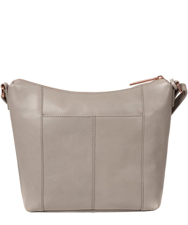 The 'Monamy' shoulder bag from Pure Luxuries London is handcrafted from beautiful leather for a luxuriously smooth finish. Concealed under a zip-over top is a 100% natural cotton lining complemented by two slip pockets, perfect for storing your phone and keys. A mock-buckle secures a magnetic fastened pocket alongside rear slip pockets that are ideal for on-the-go storage. Comes with a slimline strap that has a drop length of 65cm and is adorned with the reinvented rose gold Pure Luxuries logo.