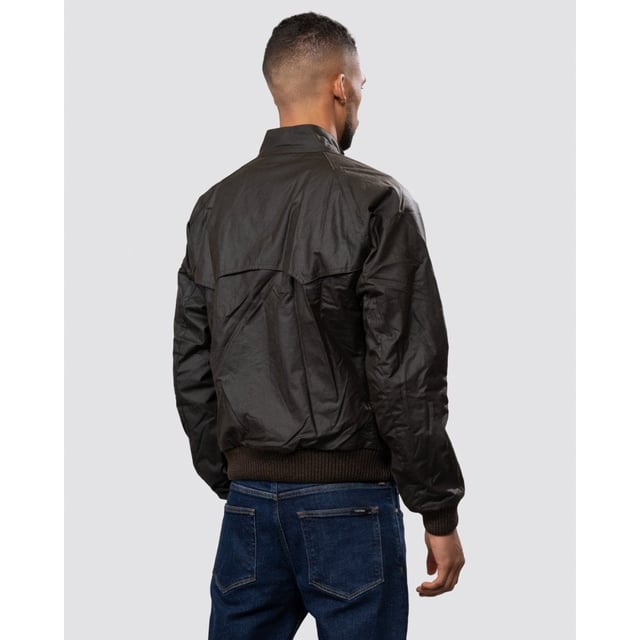 From the Steve McQueen™ International collection, the Merchant jacket is a bomber-style waxed jacket made with a tough waxed cotton outer, inspired by the jackets worn by the American actor and racer.
Durable enough for everyday, the Merchant is a simple, robust jacket that's medium weight with a quilted nylon lining for extra warmth. A corduroy-lined funnel neck with stud close gives the classic International look. Ribbed fabric on the sleeves and waist allow extra wind protection and stud-close angled pockets keep hands free.

Tailored Fit
99% Cotton, 1% Elastane
Denim, rinse wash
Barbour International denim branding pack with waist rider, leather patch, hang loop and tear off fit label.
Sponge clean only&nbsp;