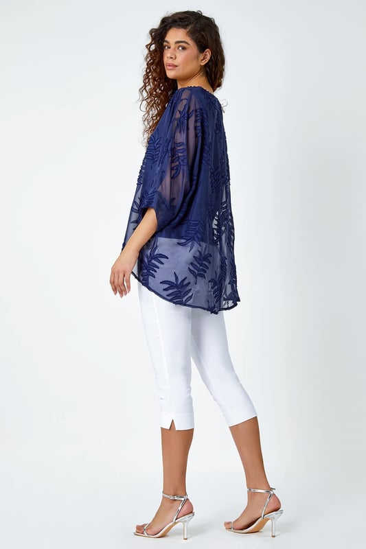 Leaf Burnout Print Chiffon Overlay Top from Roman. Dare to reveal all? Well this stunning mesh leaf embossed top is perfect for those evenings out. Featuring a round neckline with 3/4 length batwing sleeves, finished with a longer back hem and a silky cami top lining underneath for that added extra glam. Opt for faux leather leggings and heels for date night or alternatively some cropped trousers and wedges for your holiday night out.