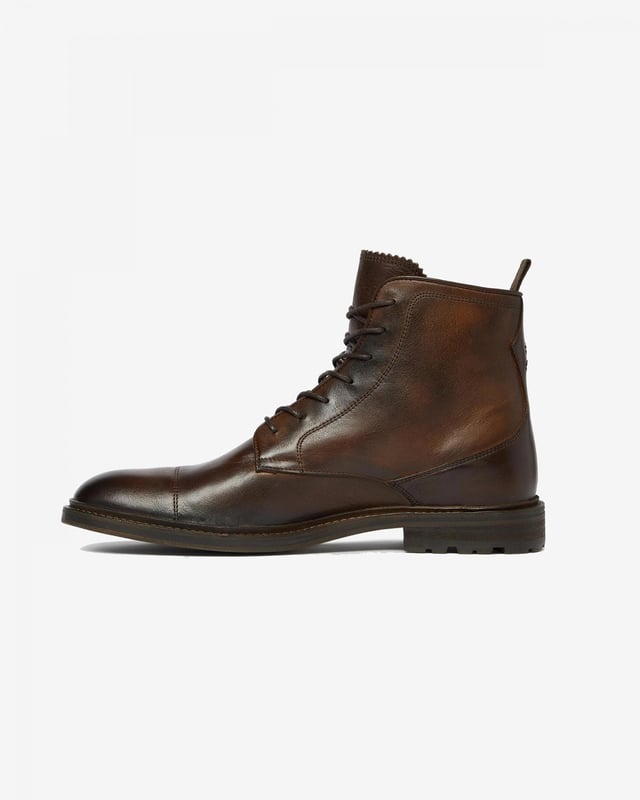 Chaves is a beautifully casual derby boot, perfect for weekend walks. Hand crafted in dip dyed leather for a unique finish and a rich depth of colour, it's then finished with a cleated rubber sole for added grip and durability.

Dip dyed leather upper
Calf leather lining
Leather sole with rubber inlay
Cotton heel pull tab
Hand-burnished toecap

 