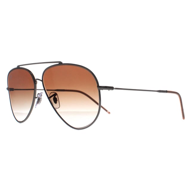 Ray-Ban Aviator Unisex Gunmetal Brown Gradient RB0101S Aviator Reverse  Sunglasses are a captivating reimagination of the classic aviator design. Crafted with meticulous attention to detail, these sunglasses feature a striking reverse color scheme, accentuating the iconic teardrop-shaped lenses and sleek metal frame. The bold contrast of colors adds a contemporary edge while maintaining the timeless appeal of the Aviator style. Engineered for both style and durability, these sunglasses offer superior UV protection and comfort, making them an essential accessory for those who appreciate fashion-forward design and unparalleled quality.