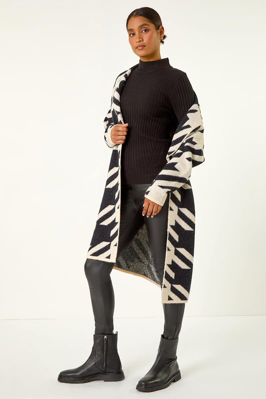 Houndstooth Coatigan from Roman. Make a stylish statement this Autumn Winter with our houndstooth knit coatigan. Featuring a flattering edge-to-edge opening and long sleeves to keep you warm, this luxurious mix of soft fabrics is designed in a striking houndstooth pattern that is perfect for your trendy fall outfits. Finishing below knee length, it's a must-have piece to elevate your wardrobe. Pair with jeggings and ankle boots for a complete look.