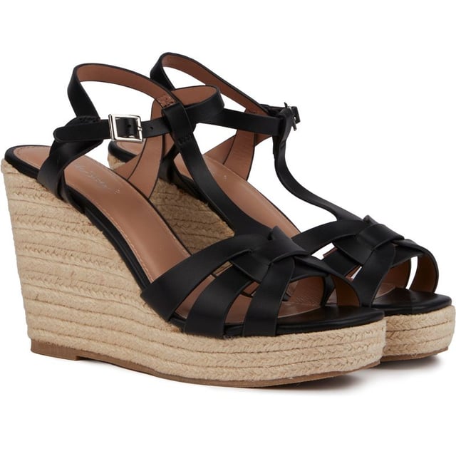 Sandalias alpargatas con cuña Solesister desri de mujer en color negro, fabricadas en sintético y suela sintética. Composición: alpargata con cuña y plataforma y forro y calcetín sintético.