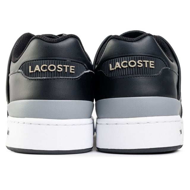 Mens black Lacoste court cage trainers, manufactured with leather and a rubber sole. Featuring: textile lining, ortholite insole, iconic croc branding and cup sole construction.