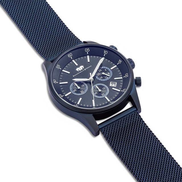 The premium men's watch from the Rhodenwald & Söhne manufactory combines the look of legendary chronograph master's works with a contemporary material concept. The popular functions of 24-hour display, stopwatch and date are integrated into a classic tricompax arrangement-a suitable companion for a business suit as well as to casual jeans. The model inspires with a hard-wearing stainless steel housing with a satin IP coating, bezel, strokes, sticker and precise quartzrugwerk. The highlight is the filigree mesh look of the noble Milanais bracelet made of ion splatted stainless steel.