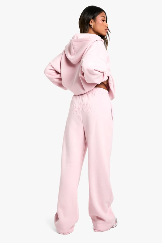 Straight-leg joggers for a modern, relaxed silhouette
        Cosy hood for added warmth and style
        Coordinating set with matching hoodie for a cohesive look
        Versatile design suitable for various casual occasions
        Comfortable fit ideal for all-day wear
    
    Embrace laid-back chic with these straight-leg joggers from Boohoo. Perfect for the fashion-forward woman in her early to mid-20s, these joggers offer a fresh take on casual wear. The straight-leg design provides a contemporary twist on traditional joggers, creating a sleek silhouette that's both comfortable and stylish. Pair with the matching hoodie for a coordinated ensemble that's perfect for casual outings, family gatherings, or relaxed weekends at home. Style with trendy trainers and a cropped top for a youthful, street-style inspired look, or dress up with a fitted bodysuit and statement jewellery for a night out with friends. These versatile joggers are a must-have addition to any casual wardrobe, offering endless styling possibilities for the social butterfly who values both fashion and comfort.