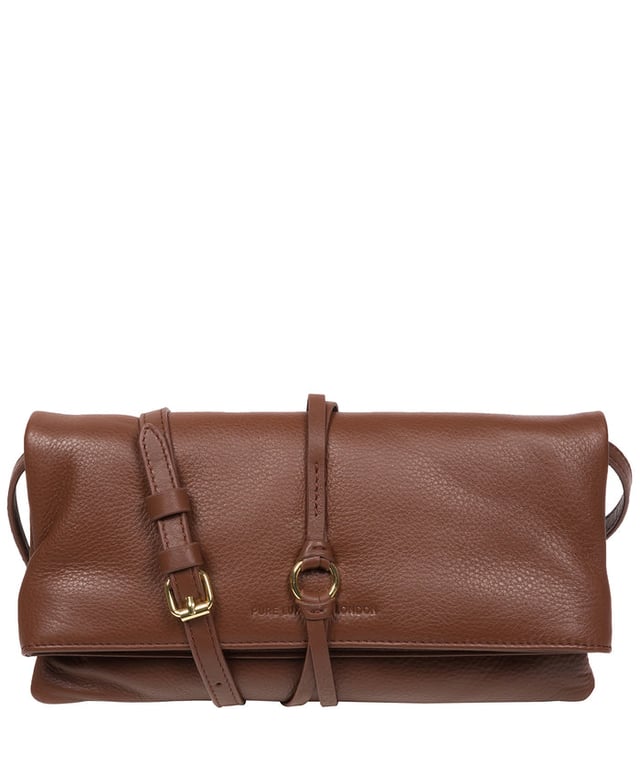 The 'Selene' cross body clutch bag from the Pure Luxuries Marylebone Collection is handcrafted from high-quality, genuine Nappa leather with a natural super-soft touch. The fold-over top secured by two magnetic press studs, opens to reveal a zipped main compartment and a slip pocket. The interior is lined with 100% cotton and includes two slip pockets to help maintain an organised bag. Comes with a matching and adjustable slim leather strap, with a maximum drop length of 65cm. The strap is also removable, transforming the bag into a clutch bag. Features gold-coloured metal fittings and zip. The Pure Luxuries logo is embossed for an effortless and sophisticated finishing touch.