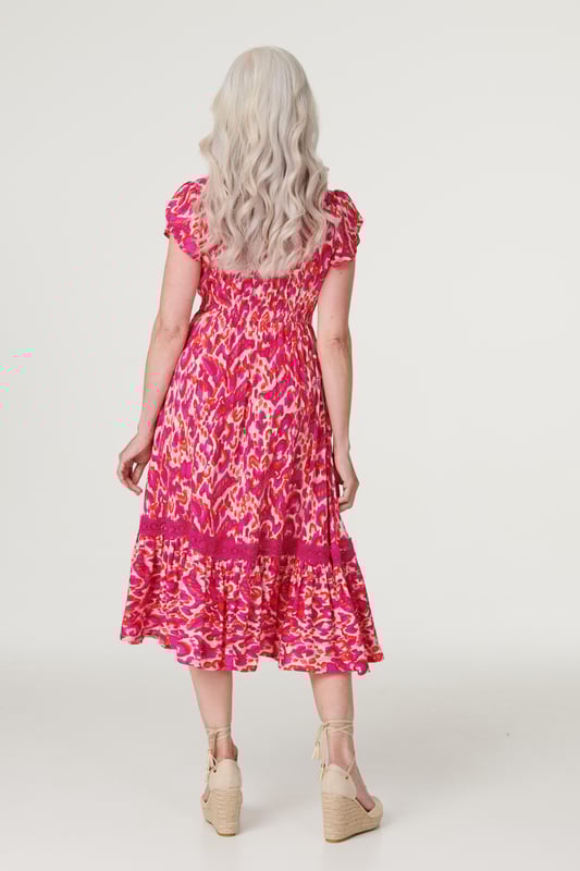 Add a statement maxi dress to your closet with this vibrant printed a-line dress. With a V-neck, a button front, frilled cap sleeves, pockets and a crochet detail tiered midi skirt. Style with blush heels and a clutch bag for a garden wedding or dress down on holiday with sandals.
