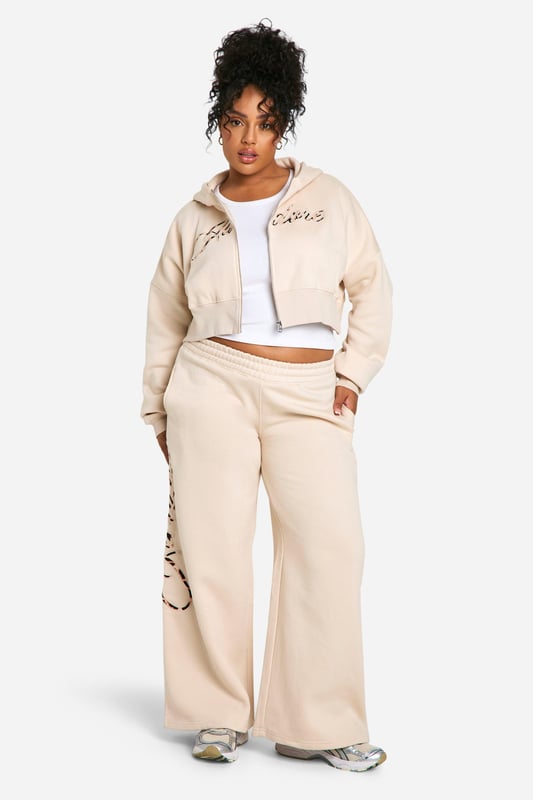 Striking leopard print design for a bold statement
        Wide-leg trousers for ultimate comfort and style
        Zip-up hoodie with cropped length for a trendy silhouette
        Coordinated set perfect for effortless dressing
        Soft cotton blend fabric for all-day comfort
    
    Make a fierce impression with this eye-catching leopard print tracksuit from Boohoo. The wide-leg trousers offer a relaxed fit that's perfect for lounging or running errands, while the cropped zip-up hoodie adds a contemporary twist to the classic tracksuit silhouette. Ideal for casual outings, this coordinated set allows for easy mixing and matching. Style it with chunky trainers and a crossbody bag for a laid-back weekend look, or dress it up with heeled boots and statement jewellery for a night out with friends. The versatile design makes it suitable for various casual occasions, from coffee dates to family gatherings. Embrace your wild side and stand out from the crowd in this bold and comfortable tracksuit that combines fashion-forward design with everyday wearability.
