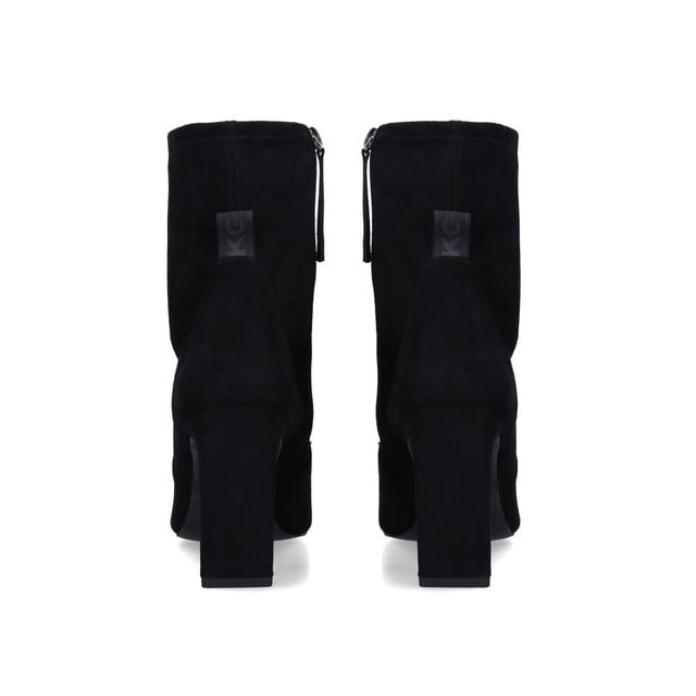 The Vegan Thara2 ankle boots feature a black suedette upper with relaxed ankle. The inner zip uses a woven and branded pull tab coordinating with the tab at the back of the heel. The toe is pointed opposite the 90mm block heel. This product is registered with The Vegan Society ensuring there are no animal products used during production.