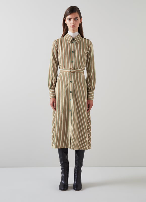 The shirt dress is an LKB sigture, and our new Frances dress takes on a utilitarian twist with feminine flair - and flare. Crafted in Europe from a sustaible viscose rich fabric in tan with green and white stripes, it's a classic collared, button-through style with horn-effect buttons, epaulettes to the shoulders, long sleeves with elegant cuffs, a bucked belt and a midi-length flared skirt. Wear it over a polo neck and long boots now, and shed the layers once the weather warms up.