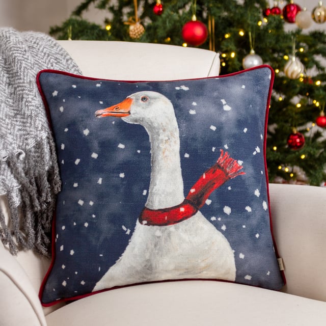 In typical realistic acrylic hand-painted, printed quality and rich colours, a Goose keeps warm in the falling snow by donning a winter scarf against a chilly navy blue background. A charming and playful cushion to put out during the holiday season while still preserving a rustic country sense to your home decor.