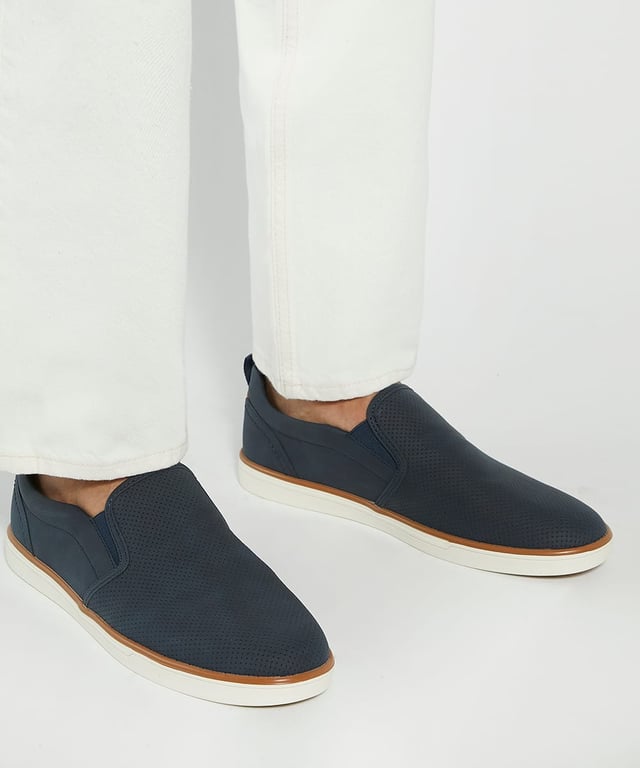 Dune Mens Totals - Perforated Embossed Casual Shoes Refine your casual styling with Totals. Our sleek profile is embossed with a perforated effect for a touch of sophistication. Designed for ease, the back tab pull ensures effortless wear, while the comfort-padded sock enhances every step with a cushioned feel.