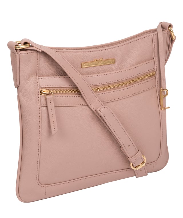 The 'Lewes' cross body bag from Pure Luxuries London, is crafted from naturally milled leather with a beautifully distinct fine-grain feel. A zip-over top secures a gorgeous, 100% natural cotton-lined interior with two slip pockets. On-the-go storage comes in the form of an exterior zipped pocket and two slip pockets, complemented by an adjustable and matching leather shoulder strap. Furnished with gold coloured metal fittings and the elegant Pure Luxuries London charm and logo plate.