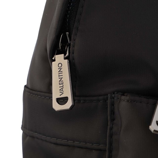 Mens Valentino Crossbody Bag in black.- Spacious main compartment  suitable for a4 documents.- Backpack straps: padded  breathable padded.- One zip pocket on the front.- Closes with zipper.- Padded laptop compartment.- Padded compartment for tablet - iPad.- Fittings of anthracite-coloured metal.- 90% Nylon  10% Polyurethane.- Ref: VBS47301