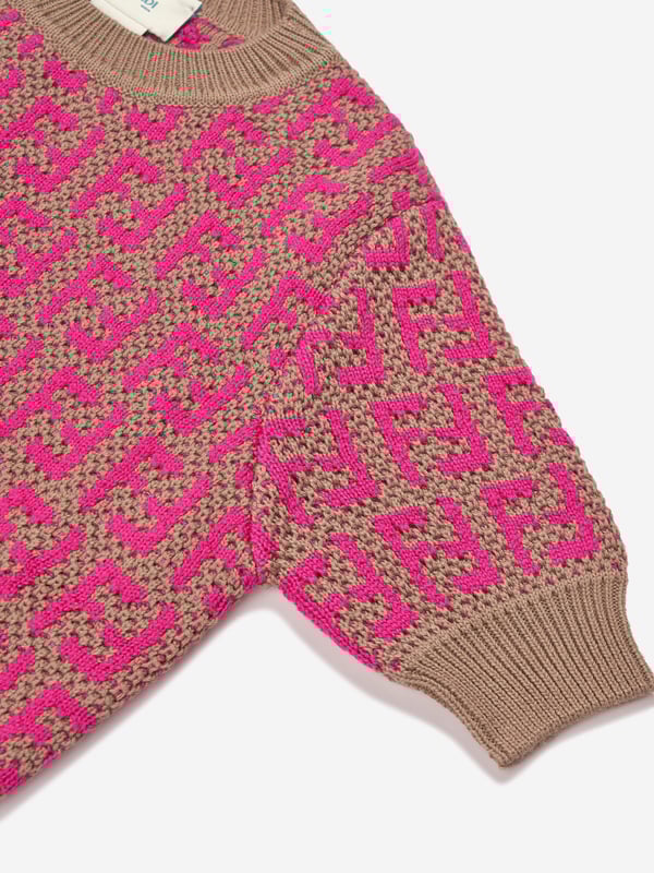 Fendi incorporate passion and energy into their meticulously crafted designs. Made in a beautiful wool and cotton combination, this girls knit top is depicted with the iconic FF monogram patterning all-over via ribbed trims and a straight hem. She will look and feel divine.  Made In Italy Cotton 50%  Wool 50%  Trim: 100% Cotton