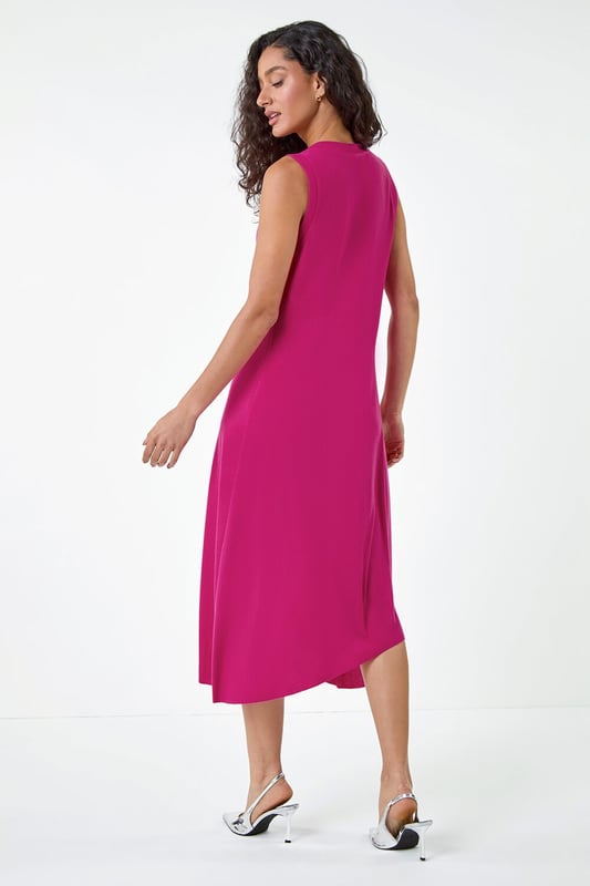 Asymmetric Sleeveless Stretch Midi Dress from Roman. Keep your style simple and chic this season with this sleeveless Dusk midi dress. Cut from a comfortable stretch jersey fabric, this dress features a modest round neckline and a Summer ready sleeveless style. Cut in a flattering fit and flare shape with a floaty asymmetrical hemline, this dress is designed to pull-on for quick and easy dressing. Falling to a modest midi length with a unique diagonal dropped waist, this dress can be dressed up or down to suit any occasion. Add sandals and sunnies for a simple Summertime look!