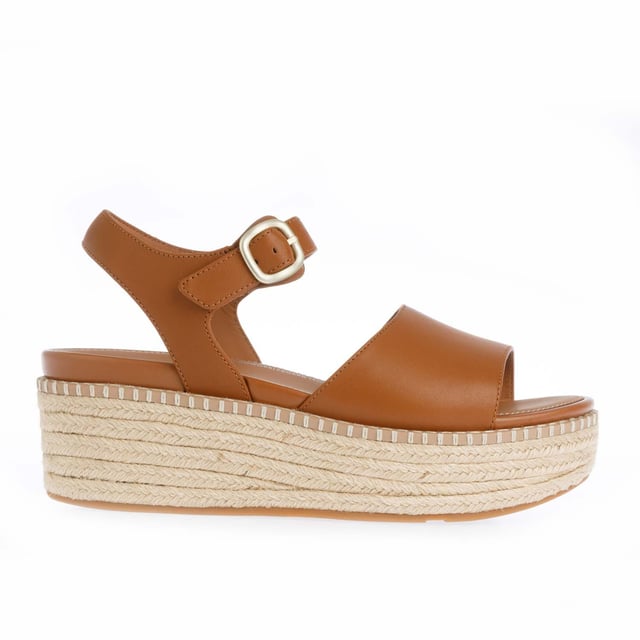 Womens FitFlop Eloise Espadrille Leather Back-Strap Wedge Sandals in light tan.Elevate your look - in every sense - with espadrille sandals on FitFlop's comfort-engineered high wedge sole.- Smooth high-quality leather uppers.- Lightly padded backstrap with adjustable buckle. - Comfortable cotton twill and leather-lined upper.- High wedge sole wrapped in natural jute for a laidback-chic summery vibe.- Statement stitching detail around the top of the sole.- Microwobbleboard midsole - absorbs shock  diffuses pressure and provides extraordinary comfort.- FitFlop branding to footbed.- Slip-resistant rubber outsole.- Average to wide fit.- Wedge height 2.8“ - 7.1cm approximately.- Leather and textile upper  Leather and textile lining  Synthetic sole.- Ref: HS5-592Measurements are intended for guidance only.