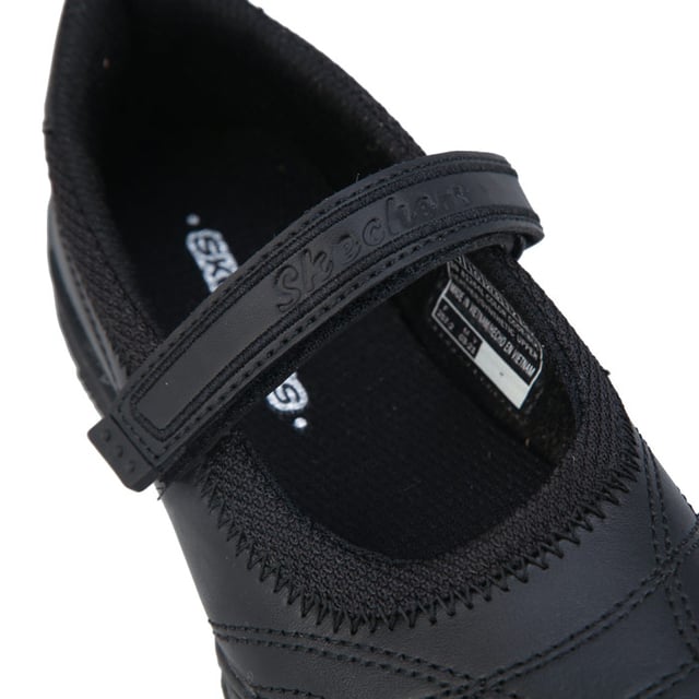 Junior Girls Skechers Velocity Pouty Shoes in black.- Synthetic and leather upper.- Hook and loop closure.- Single strap.- Skechers label on strap and heel.- Stitched detailing throughout. - Lightweight.- Cushioned insole.- Leather and synthetic upper  Textile lining  Synthetic sole.- Ref: 81264LBBKJ