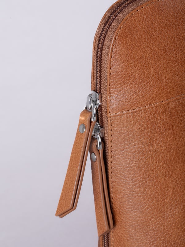 The Talkin handbag collection is a study in sleek sophistication, and this practical backpack is no exception. Crafted from soft premium leather, this classic style has plenty of space to ensure you can carry all your essentials with ease. The adjustable leather straps offer unparalleled comfort, and we've included a grab handle for convenient carrying.