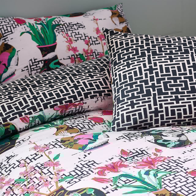 Inspired by Japanese geometric patterns, the injections of colour from the flowers and vases alongside the contrasting geometric monochrome design create a striking and fantastic centrepiece for your bedroom.