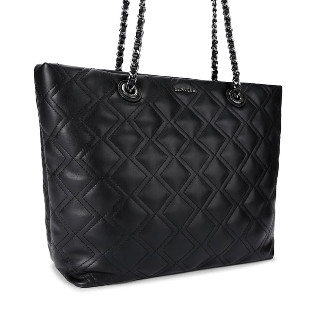 This Carvela Rosa Chain Tote Bag features a black leather alternative exterior with diamond quilting detail. There are two shoulder straps which have gunmetal chain detail to match the branding on the front of the bag. Dimensions: 29cm (H), 34cm (L), 12cm(D). Strap length: 57cm.