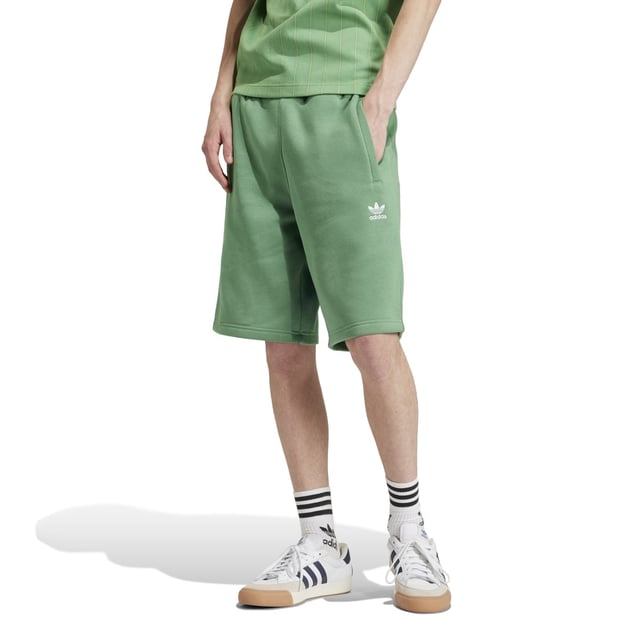 Mens adidas Originals Trefoil Essentials Shorts in preloved green.Going beyond basic  these adidas shorts are built for everyday comfort. The cotton-fleece blend is easy to wear  and zippered pockets stash the essentials so you can keep living life on the go. The versatile design is ready to pair with anything from a tee to a sweatshirt. However you wear them  these shorts will become the pair you reach for time and again.- Simple shorts destined to become a favourite top-drawer choice.- Regular fit- Drawcord on elastic waist- 70% cotton  30% polyester (recycled)- Side zip pockets- Ref: IU2355