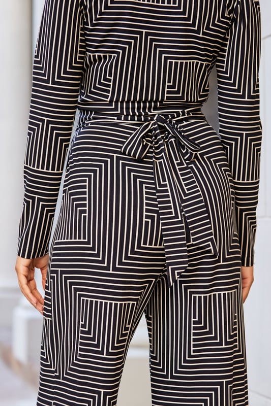 Dressing up doesn't always mean dressesYou'll love the flattering wrap frontElongating wide legsSoft and stretchy fabric for style and comfortStyle with gold hoops and platforms for big night out vibesInside leg to fit: Short 29" | Regular 31" | Long 33"