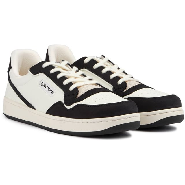 Introducing The Good News Mack Trainers - The Perfect Blend Of Style And Sustainability. Made With An Upper Material That's 80% Bio Veg, With 100% Recycled Mesh Lining And A Sole Material That's 70% Natural Rubber, These Black And White Trainers Are A Step Towards A Greener Future. The Retro-inspired Trainers Are Ready For Your Urban Adventures And Every Day Chores.