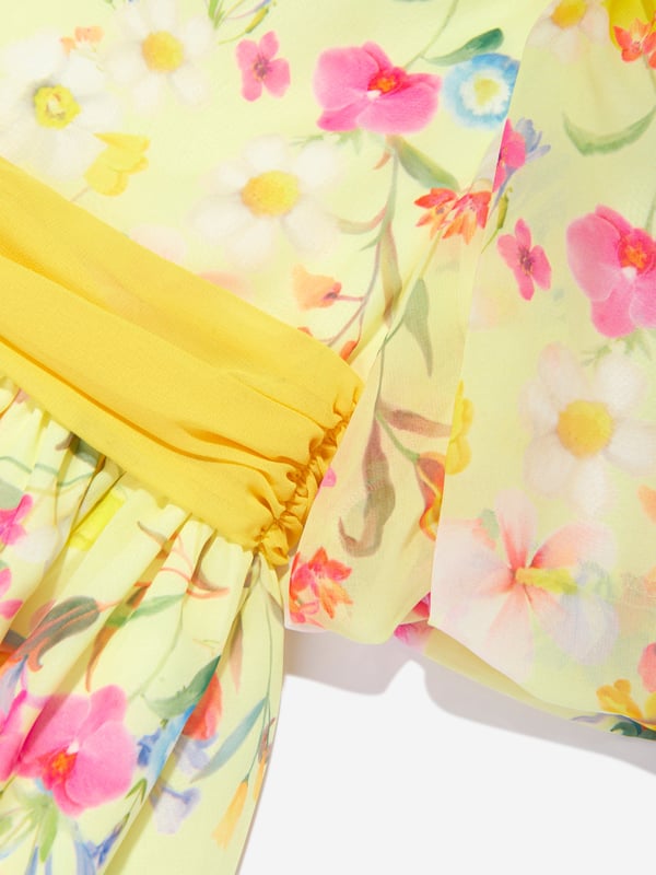 Presenting the Girls Floral Party Dress in Yellow by Patachou, a striking addition to any Girls' wardrobe. Perfect for Easter and beyond, its key attributes include: Stylish Design: The charming floral print adorns this dress, instilling a contemporary yet playful edge, marking it as a standout ensemble. Optimum Comfort: Crafted from superior materials, this dress ensures lasting comfort while your child embarks on daily explorations.  Wardrobe Upgrade: Elevate your Girls' wardrobe with this stunning yellow dress from Patachou. Purchase today for an instant style uplift!