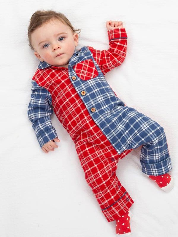 100% organic cotton | Proud to be certified by Control Union to the Global Organic Textile Standard (GOTS) | Red and navy blue brushed cotton flannel check | Coconut button fastening and popper crotch opening | Single front chest pocket | Long sleeved | Revere collar shape | Self-fabric cuffs with piping details | Made in India | Machine washable at 40 degrees, or at 30 degrees to be kinder to the planet