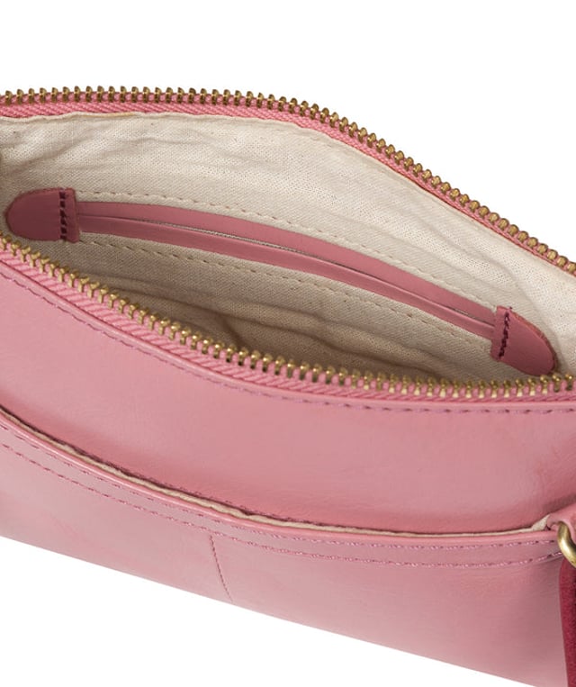The 'Sweetie' cross body bag from Conkca London is handcrafted from multi-toned leather for a beautiful finish. A zip-over top opens to reveal a spacious yet compact main compartment with two slip pockets, lined with natural and untreated 100% cotton. Features a zipped pocket on the front and a slip pouch on the rear, ideal for on-the-go storage. Comes with an adjustable leather strap with a maximum drop length of 70cm. Adorned with the inimitable Conkca squirrel charm and Conkca logos.