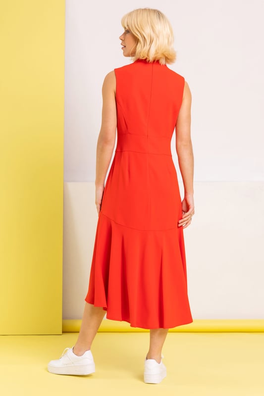 High Neck Dipped Hem Midi Dress from Roman. Effortlessly stylish and elegant in choice this Dusk high neck midi dress is the perfect go to all year round. Versatile in style, this flattering shape skims the figure into a dipped frill hemline, complimented with a waist panel. It's a sure favourite this year, styled with sneakers or high heels and a cropped jacket this dress will take you from day to party with just a change of accessories, getting you ready for any occasion!