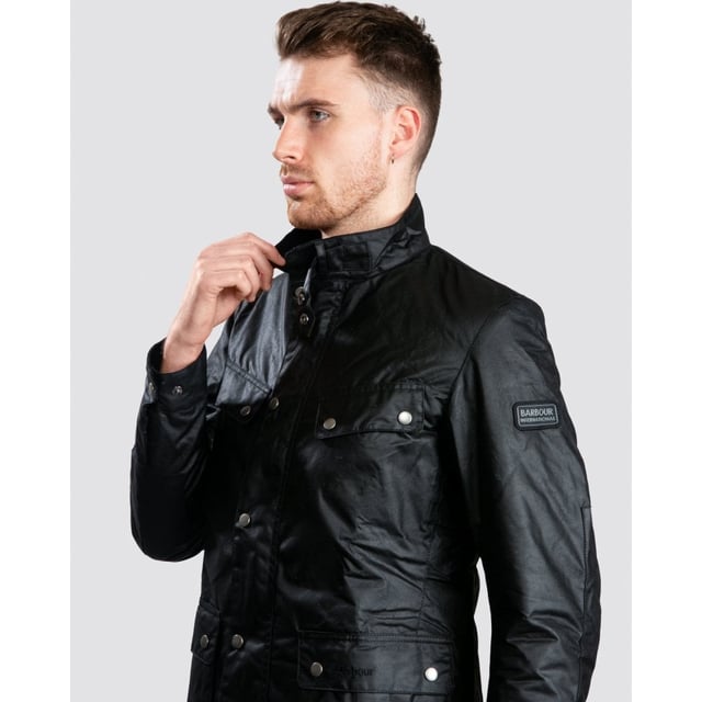 A mainstay of the World Tour collection, the Duke is a re-work of the iconic Enfield jacket in a winter-ready waxed cotton.
With biker styling and a robust construction, the Duke is crafted in Barbour&rsquo;s 6oz Thornproof wax for durable protection with a lustrous finish, complete with a two-way zip and hardy studded storm fly front. A quilted nylon lining adds warmth, while the cosy funnel collar and stud-fastening cuffs boast a contrast corduroy lining for incredible softness and a signature Barbour look.
Paying homage to Barbour&rsquo;s motorcycle heritage, authentic detailing includes elbow patches, four studded pockets and a collar strap. The lower bellow pockets feature a stylish pleat and are generously proportioned to carry essentials without adding bulk, while a zipped inner pocket safeguards valuables. Available in four versatile colours with the Barbour International badge to the sleeve, the Duke is subtly tailored with a relaxed fit ideal for winter layering.

Back length: 28.5–32" | 71.5–81.5cm
Mediumweight 6oz Thornproof wax outer
Sponge clean only