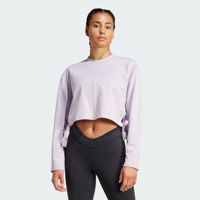 Take your yoga flow from studio to city in this yoga cover-up. Made for comfort inside and out, this soft French terry top keeps you cosy before, during and after your practice. adidas AEROREADY keeps you dry when the heat is on. Slightly cropped and with hem ties, this cover-up layers perfectly over your favourite yoga bra.By choosing recycled, adidas are able to reuse materials that have already been created, which helps to reduce waste. Renewable materials choices will help us to remove our reliance on finite resources. Our products made with a blend of recycled and renewable materials feature at least 70% total of these materials.  -