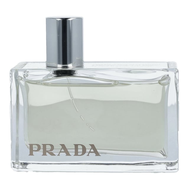 Discover the luxurious Prada Amber Eau de Parfum Spray, a captivating fragrance that embodies elegance and sophistication. This exquisite scent, crafted over three years by renowned perfumers Max Gavarry and Carlos Benaïm, features a harmonious blend of rich amber, sandalwood oil, patchouli leaf, labdanum, and benjui. Perfect for the modern woman, this 80ml bottle is an essential addition to your fragrance collection. Experience the art of traditional perfumery reimagined with Prada.