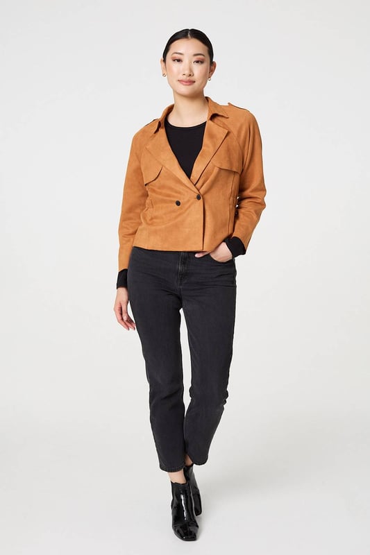 Add an extra layer lo your look with this cropped jacket. It's made from a soft suede feel fabric; and you can wear it over any outfit, including formal dresses or eveningwear. It has a lapel collar and button details, with long sleeves and a fitted shape. Pair this cropped jacket with smart trousers and you can wear it to work too.
