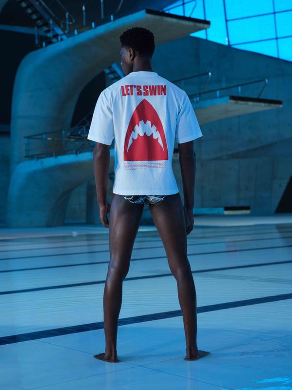 Turn heads in our LET'S SWIM print t-shirt. Featuring our iconic shark head logo on the front and back with brand manifesto printed underneath. Perfect for sharing with your fellow shark obsessed partner.