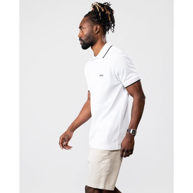 A signature polo shirt by BOSS Menswear, cut to a regular fit. Featuring contrast tipping and a logo at the left chest, this short-sleeved polo shirt is designed in cotton piqué and detailed with further BOSS branding at the undercollar.
Regular fit. Flat-knit collar. Number of buttons: 3. Short sleeves. Flat-knit cuffs. Standard length. 100% Cotton.
50469055
Model is 5"8 and wears size M