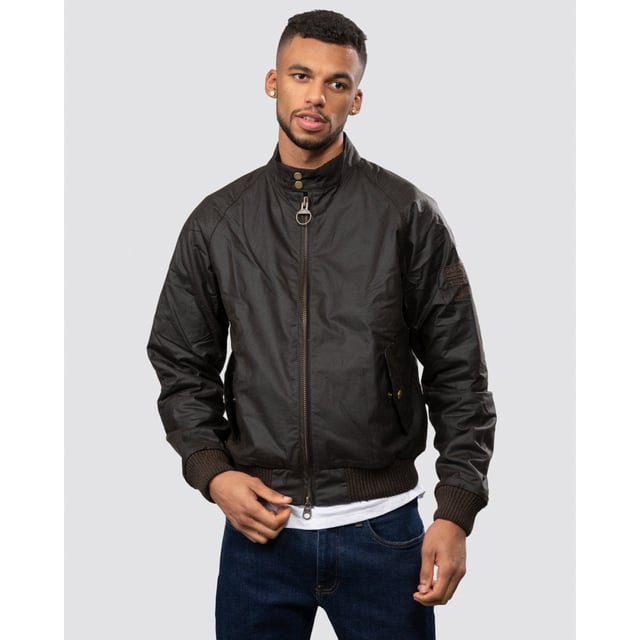 From the Steve McQueen™ International collection, the Merchant jacket is a bomber-style waxed jacket made with a tough waxed cotton outer, inspired by the jackets worn by the American actor and racer.
Durable enough for everyday, the Merchant is a simple, robust jacket that's medium weight with a quilted nylon lining for extra warmth. A corduroy-lined funnel neck with stud close gives the classic International look. Ribbed fabric on the sleeves and waist allow extra wind protection and stud-close angled pockets keep hands free.

Tailored Fit
99% Cotton, 1% Elastane
Denim, rinse wash
Barbour International denim branding pack with waist rider, leather patch, hang loop and tear off fit label.
Sponge clean only&nbsp;