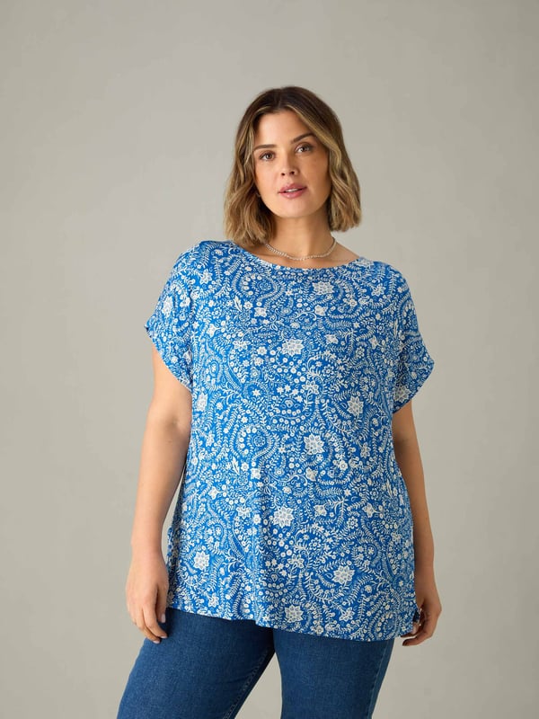 Printed all over with a pretty blue paisley print, this top is cut from the softest of jerseys which is so comfortable to wear. With a round neckline and short sleeves, it has a slightly A-line shape which is so flattering, making it the perfect throw-on top.