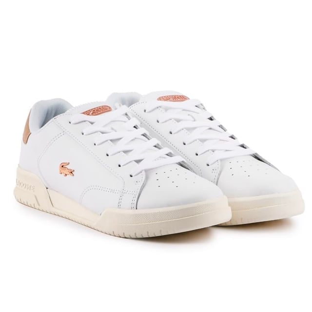 Lacoste Twin Serve Trainers Lacoste's Twin Serve Women's Court Trainer Is A Fashion Icon Tennis Court Inspired With Retro Appeal. This White Pair Features A Rose Gold Metal Croc Logo, Fine Stitching, Heel Detail, Blind Eyelets And A Padded Ortholite Insole For Extra Comfort. A Lovely, Fresh Addition To Your All-season Wardrobe.