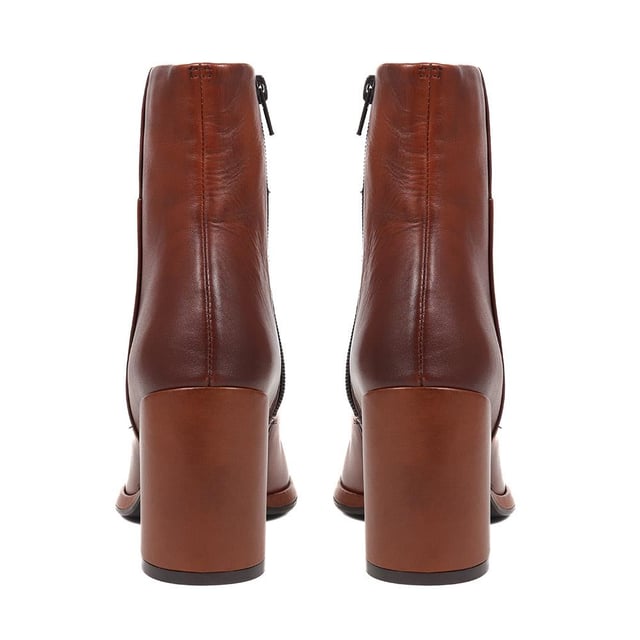 Cultivated elegance meets edgy design with these heeled leather ankle boots. Elevate every stride; the city streets are your new catwalk.