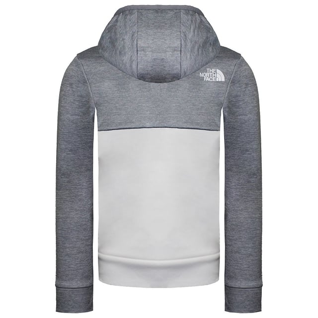 The North Face New Mittelegi Kids Grey Jacket is a versatile and stylish outerwear piece designed to provide your child with comfort and protection during outdoor activities and everyday wear. Here are some key features and details about this jacket:

 Durable Construction:  The North Face is known for its high-quality materials and craftsmanship, and the New Mittelegi Kids Grey Jacket is no exception. It's designed to withstand the rigors of outdoor play and maintain its integrity over time.

 Warm and Insulated:  This jacket is equipped with insulation to keep your child warm and cozy in cold weather. It provides the necessary warmth without excessive bulk, allowing for freedom of movement.

 Water-Repellent Finish:  The jacket features a water-repellent finish that helps keep your child dry in light rain and snow, ensuring they stay comfortable in damp conditions.

 Full-Zip Front:  The full-zip front allows for easy on-and-off and quick temperature adjustment, making it a versatile piece for changing weather conditions.

 Attached Hood:  The jacket comes with an attached hood that can be adjusted for a secure fit. It provides extra protection and warmth on windy or rainy days.

 Zippered Pockets:  Zippered hand pockets offer secure storage for small essentials like gloves, snacks, or a phone.

 Elastic Cuffs and Hem:  Elastic cuffs and a hem provide a secure fit, preventing cold air from entering and maximizing warmth.

 Versatile Style:  The New Mittelegi Kids Grey Jacket boasts a classic grey color and a stylish design, making it suitable for various occasions, from outdoor adventures to casual wear.

 North Face Logo:  As with all North Face products, this jacket proudly displays the iconic North Face logo, a symbol of quality and outdoor adventure.

 Reflective Details: For added safety in low-light conditions, the jacket includes reflective details that enhance visibility, ensuring your child stays safe during evening outings.

The North Face New Mittelegi Kids Grey Jacket is a reliable and comfortable choice for keeping your child cozy and stylish during their outdoor adventures and everyday activities. Its combination of durability, comfort, and timeless design ensures that your child is well-prepared for various weather conditions and activities. Whether they're playing with friends, heading to school, or exploring the great outdoors, this jacket offers the comfort and protection they need.